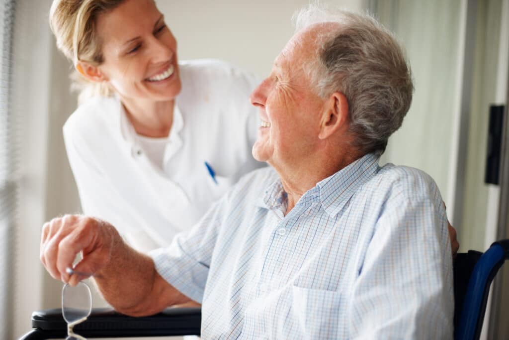 Retired couple at the hospital , senior man on the wheelchair